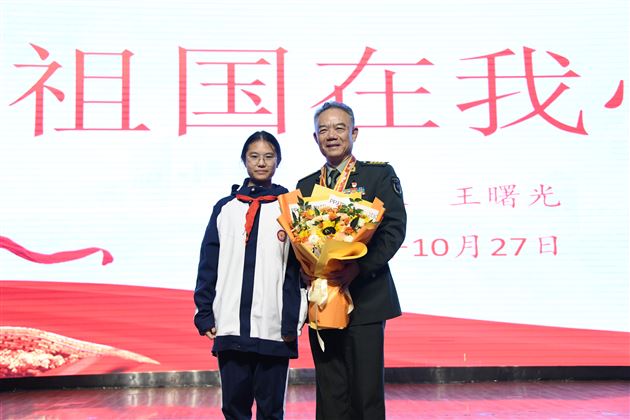 一等功臣进校园 红色基因薪火传——棠外初中隆重举行王曙光大校“祖国在我心中”主题报告会